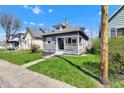 Charming bungalow-style home with a well-maintained lawn and sidewalk at 2137 Ringgold Ave, Indianapolis, IN 46203