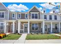 Two story townhouses with gray siding and stone accents at 3885 Wren Dr, Brownsburg, IN 46112