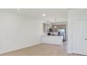 Modern kitchen with stainless steel appliances and light gray cabinets at 3893 Wren Dr, Brownsburg, IN 46112