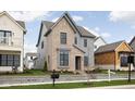 Attractive two-story home with a brick and gray siding exterior, and professionally landscaped front yard at 1659 Midland Main St, Westfield, IN 46074