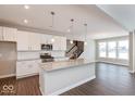 Spacious kitchen with white cabinets, granite countertops, and stainless steel appliances at 1099 Gatewick Ct, Greenwood, IN 46143