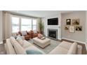 Spacious living room featuring a cozy fireplace and large windows at 1099 Gatewick Ct, Greenwood, IN 46143