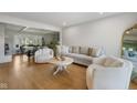 Spacious living area offering hardwood floors, comfortable seating, and a view into the adjacent dining space at 236 Bixler Rd, Indianapolis, IN 46227