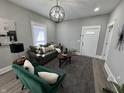Inviting living room featuring modern decor and ample natural light with front door entrance at 2869 Stuart St, Indianapolis, IN 46218