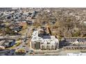 Scenic aerial view of apartment complex near downtown area, showcasing nearby shops, restaurants, and walkable neighborhood streets at 1155 S Rangeline Rd # 502, Carmel, IN 46032