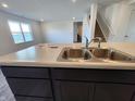 Close-up of the kitchen island featuring a stainless steel sink with a modern faucet at 3202 W Longbranch Dr, Monrovia, IN 46157