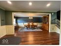 Elegant dining room with ample space for entertaining, enhanced by hardwood floors and decorative moldings at 5656 Buck Dr, Noblesville, IN 46062