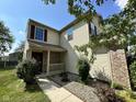 Charming home with a covered front porch and well-maintained landscaping at 1946 Central Park W Blvd, Greenwood, IN 46143