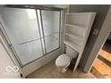 Bathroom with a shower-tub combination and functional storage space at 234 Ringwood Way, Anderson, IN 46013