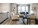 Comfortable living room with neutral furniture, large windows, and modern decor at 729 Greenford N Trl, Carmel, IN 46032
