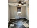 Small bedroom with tile floor and window at 304 Andover Rd, Anderson, IN 46013