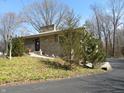 Charming single-story home with stone and siding exterior and mature trees on a well-maintained lot at 431 Vestal Rd, Plainfield, IN 46168