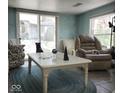 Inviting living room with ample natural light, comfortable seating, and a cozy atmosphere at 7934 S 600 W, Edinburgh, IN 46124