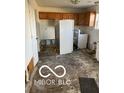 Kitchen showing upper cabinets, appliances and condition of the floor at 4322 Par Dr, Indianapolis, IN 46268