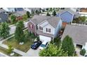 Aerial view of a two-story home in a suburban neighborhood with a two car garage at 882 Brookshire Dr, Franklin, IN 46131