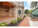 Beautiful brick home showcasing a charming porch, landscaped yard, and elegant design, creating a welcoming atmosphere at 1817 Bellefontaine St, Indianapolis, IN 46202