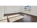 Bright and airy spare bedroom with hardwood floors and a large window at 222 Winding Brook Way, Pendleton, IN 46064
