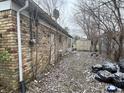 Brick home with backyard, storage shed, and mature trees at 6602 Lennington Dr, Indianapolis, IN 46226