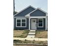 Newly built home features gray siding, white trim, and a covered porch at 1260 S Reisner Sw St, Indianapolis, IN 46221