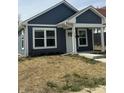 Newly constructed home with gray siding, white trim, and a covered porch at 1260 S Reisner Sw St, Indianapolis, IN 46221