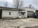 Exterior facade of house with vinyl siding, stone foundation and garage at 850 N Anderson St, Elwood, IN 46036