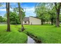 Quaint home nestled among towering trees, offering a sense of privacy and tranquility at 2747 E Midland Rd, Indianapolis, IN 46227