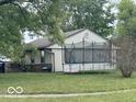View of the home's backyard showing a trampoline, well kept lawn, and providing ample space for outdoor activities and relaxation at 1902 Edgemont Way, Anderson, IN 46011