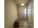 Inviting foyer with wood-look flooring and access to the main living areas at 2018 Abbey Ln, Columbus, IN 47201