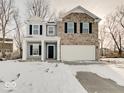 Charming two-story home featuring a two-car garage and a welcoming front porch at 3567 Windstar Ct, Columbus, IN 47203