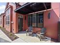 Inviting front porch with modern chairs and sleek black awning, enhancing curb appeal at 1676 Solebar Way, Westfield, IN 46074