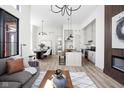 Open-concept living space featuring a stylish kitchen, dining area, and comfortable seating at 1676 Solebar Way, Westfield, IN 46074