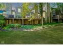 Spacious backyard with deck, landscaping, and partial view of neighboring homes at 4695 Shireton Ct, Indianapolis, IN 46254