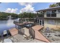 Expansive deck overlooks lake; steps lead to the water at 7438 Haw Dr, Nineveh, IN 46164