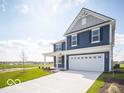 Charming two-story home featuring a spacious driveway and manicured front lawn at 1537 Hanover St, Danville, IN 46122