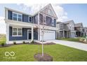 Inviting two-story home with a well-maintained lawn and proximity to neighboring houses at 1537 Hanover St, Danville, IN 46122