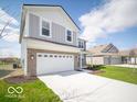 Attractive two-story home showcasing a large driveway and manicured lawn at 146 Velvet Hat Rd, Danville, IN 46122