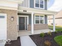 Inviting front entrance of a two-story home, including a covered porch at 146 Velvet Hat Rd, Danville, IN 46122