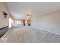 Spacious living room with new carpet leading into an open kitchen space at 1162 Meadowlark Dr, Greenwood, IN 46143