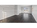 Bright bedroom with dark hardwood floors and french doors at 2103 Danbury Dr, Indianapolis, IN 46231