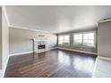Spacious living room featuring a stone fireplace and hardwood floors at 6502 Allisonville Rd, Indianapolis, IN 46220
