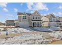 Beautiful new construction home with a two-car garage and inviting covered porch at 10133 Redwood Peak Ln, Indianapolis, IN 46259