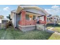 Gray house with brick front porch and steps, charming curb appeal at 2161 Napoleon St, Indianapolis, IN 46203