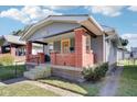 Gray house with brick front porch and steps, a great curb appeal at 2161 Napoleon St, Indianapolis, IN 46203