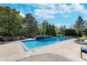 Relaxing rectangular pool with a waterfall feature at 4729 Pearcrest Way, Greenwood, IN 46143