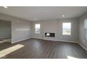 Living room with hardwood floors and a modern fireplace at 16799 Cheddar Dr, Noblesville, IN 46060