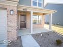 Inviting front porch with brick pillars, perfect for enjoying the outdoors at 6123 Card Blvd, Indianapolis, IN 46221