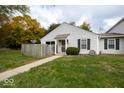 Charming home with a well-manicured lawn and inviting walkway to the front entrance at 6072 Wingedfoot Ct, Indianapolis, IN 46254
