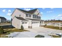 Two-story home with gray siding, white trim, and a two-car garage at 230 Mcnair Rd, Whiteland, IN 46184