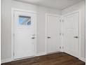 Bright entryway with white doors and dark hardwood floors at 432 Charles Freer Ln, Whiteland, IN 46184