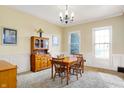 Bright dining room featuring hardwood floors and built-in hutch at 7178 Lockford N, Avon, IN 46123